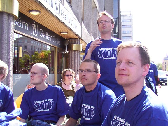 Protesters dressed in screen-blue T-shirts.